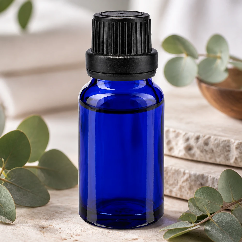 Frasco de cristal azul cobalto de 10 ml con tapón de rosca negro y anillo de precinto para cosméticos naturales