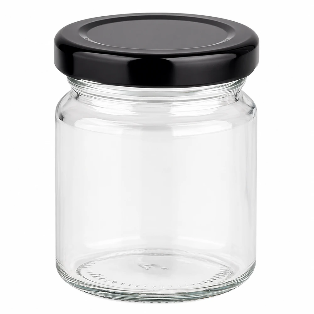 Tarro redondo de 53ml con tapa BasicSeal negro UNiTWIST Tarro redondo de 53 ml con tapa negra BasicSeal vacío sobre fondo blanco tarro pequeño de cristal para conservación