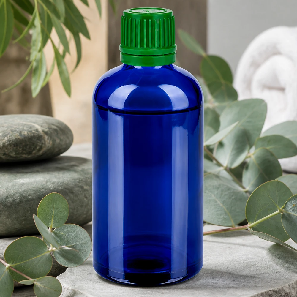 Botella de vidrio de alta calidad de 100 ml en elegante azul con práctico tapón de rosca verde de 11 mm