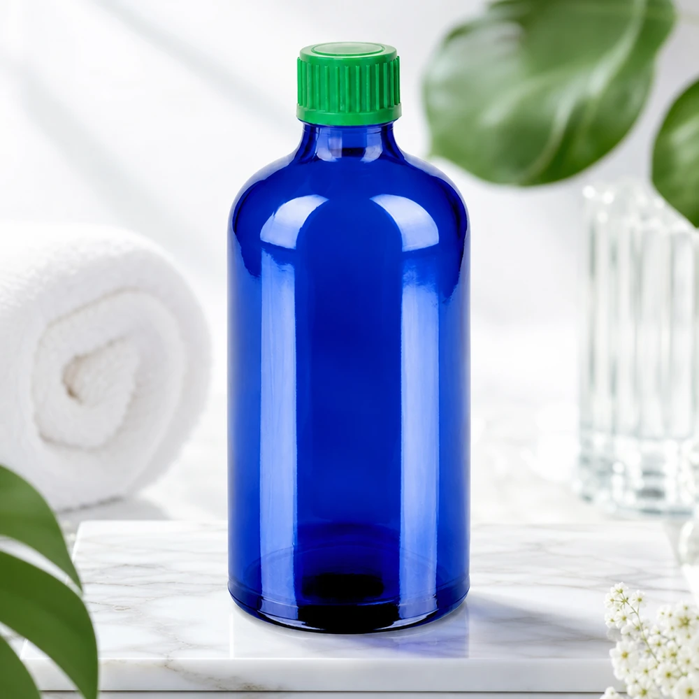 Frasco cuentagotas de 100 ml 0,8 mm verdeCierre estándar BlueLine UT18/100 Frasco cuentagotas BlueLine de 100 ml de vidrio azul oscuro de alta calidad con tapón de rosca verde para protección UV