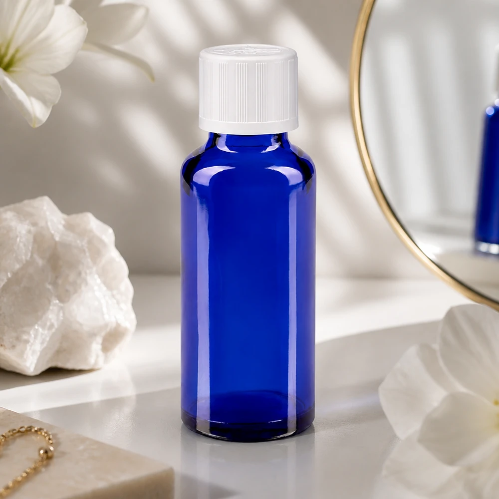 Botella de farmacia azul 30ml tapón de rosca blanco a prueba de niños estándar Frasco de farmacia esbelto de 30 ml, de cristal azul cobalto, con tapón de seguridad para niños de color blanco