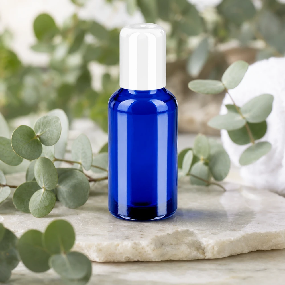 Frasco roll-on 30ml blanco tapón estándar BlueLine UT18/30 Frasco de vidrio de 30 ml de alta calidad con tapón roll-on en elegante azul cobalto para una dosificación precisa
