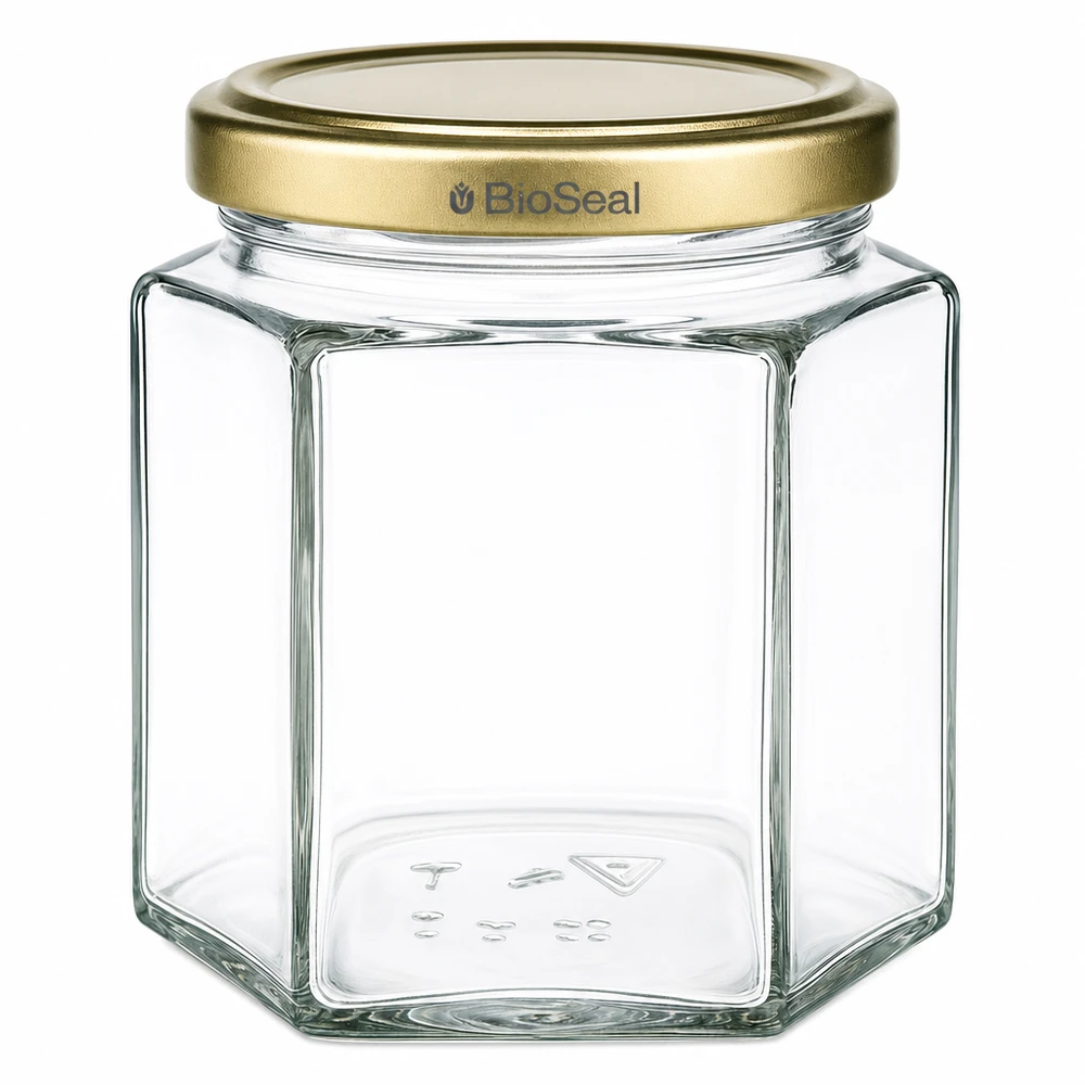 Tarro para miel de 520 g con tapa dorada BioSeal UNiTWIST Tarro de miel de 520 g hexagonal transparente con tapa dorada BioSeal para apicultores y envasado de miel