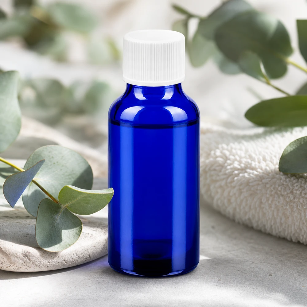Pequeño frasco de vidrio de 20 ml en azul brillante con práctico tapón de rosca para cosméticos naturales
