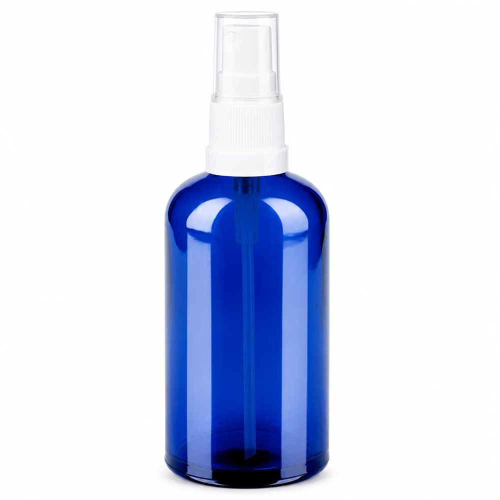 Botella de cristal azul de 100 ml con cabezal pulverizador blanco para cosmética y aromaterapia