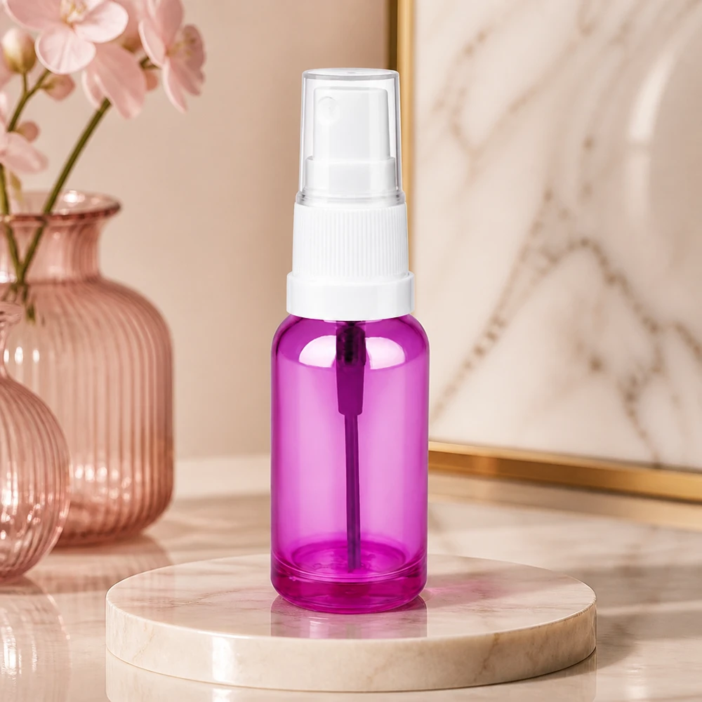 Frasco pulverizador de 20 ml fabricado en plástico transparente de alta calidad con un elegante diseño morado