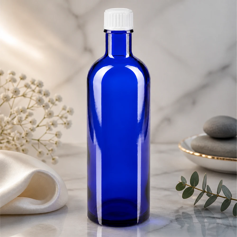 Frasco cilíndrico de farmacia de 200 ml en azul cobalto con tapón de rosca de plástico blanco