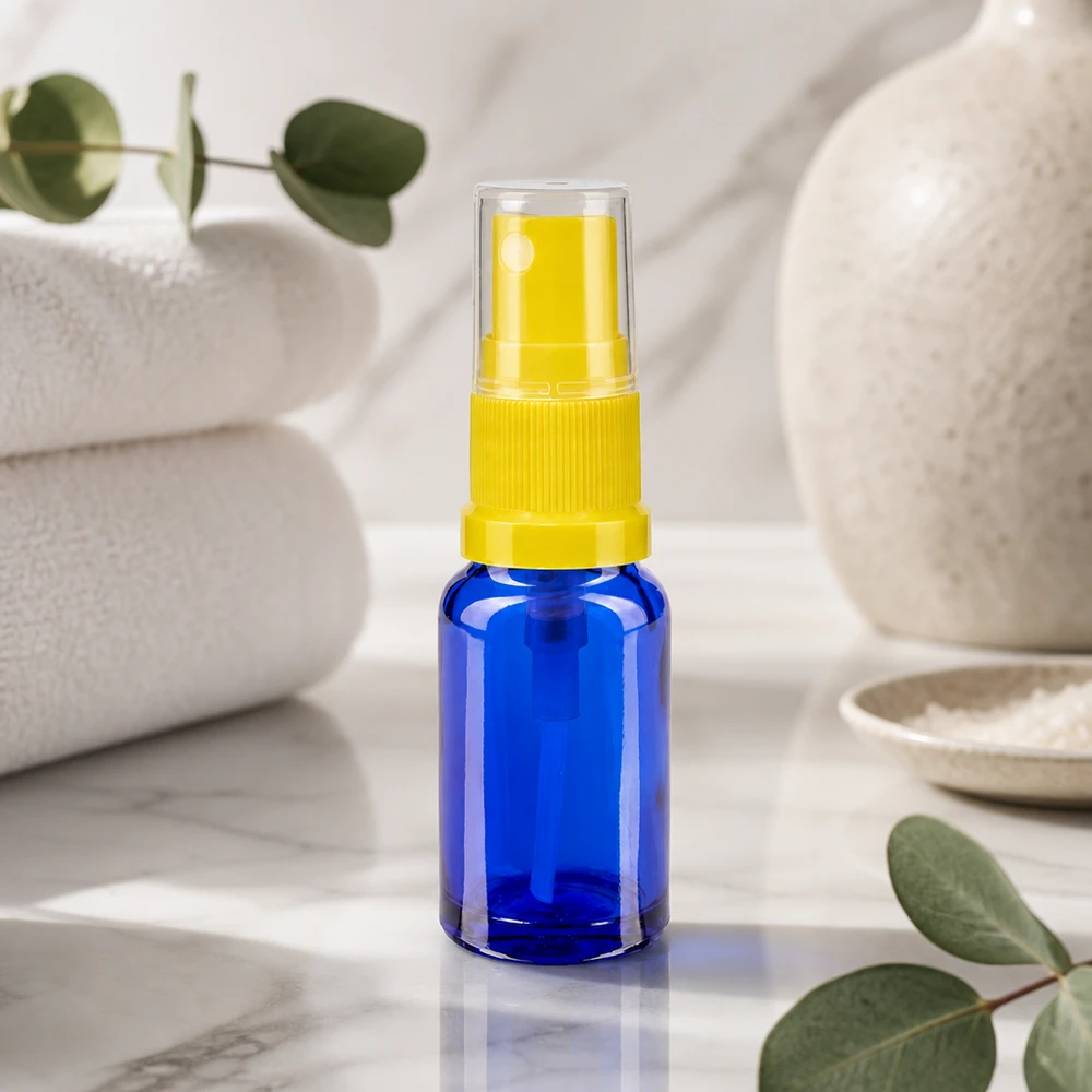 Frasco pulverizador compacto para farmacia, de cristal azul, de 30 ml, con cabezal pulverizador amarillo y tapón de seguridad
