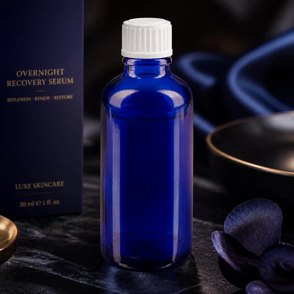 Frasco cuentagotas cilíndrico de 50 ml, de color azul cobalto, fabricado en ApoGlas, con tapón de rosca blanco para sueros