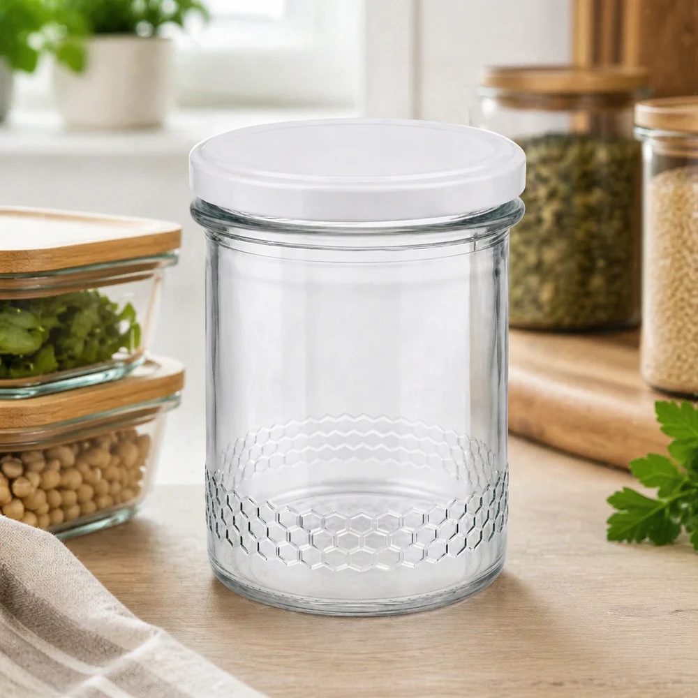 Tarro para miel de 560 g con tapa blanca BasicSeal UNiTWIST Tarro de miel de 400 ml vacío en el ambiente de la cocina con otros tarros de almacenaje decorativos con forma de panal Tapa BasicSeal