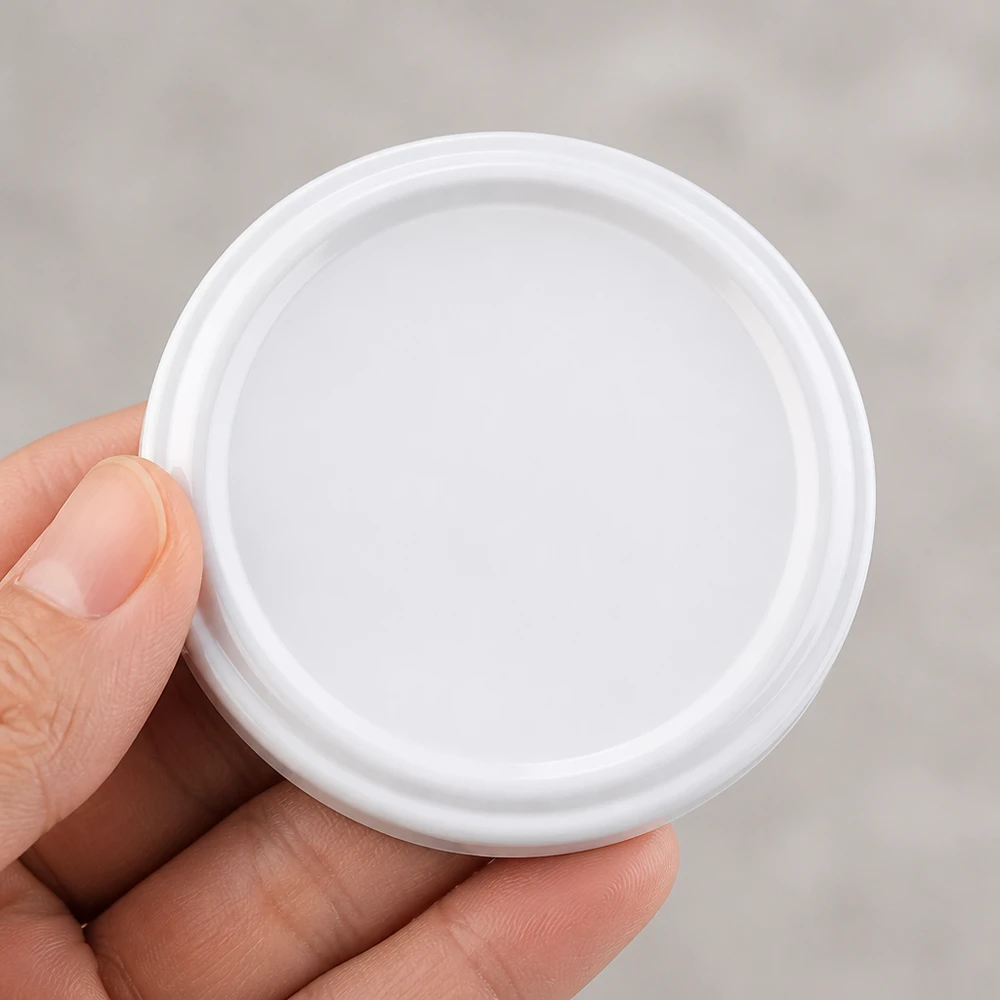 UNiTWIST TO58 blanco, BioSeal, sin BPA, unitemp UNiTWIST TO58: tapa de plástico blanco de 58 mm de diámetro con junta BioSeal en la palma de la mano