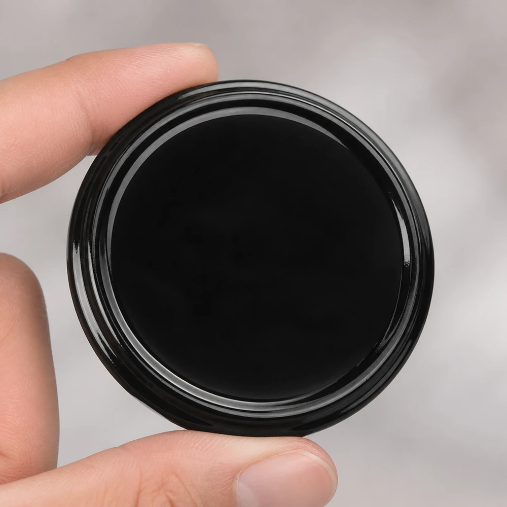 Tapa BasicSeal de 82 mm, negra, TO82, UNiTWIST, superficie brillante, primer plano