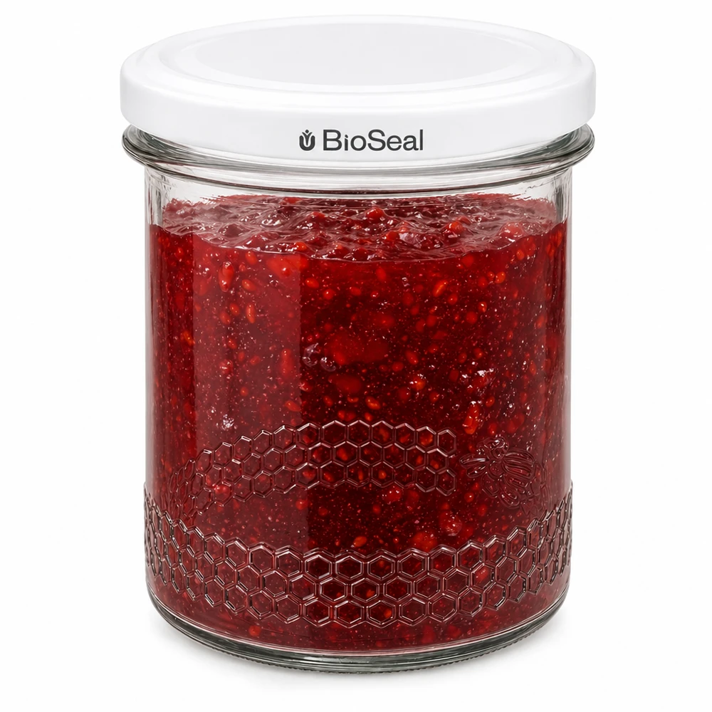 Tarro de conserva BioSeal de 400 ml lleno de mermelada roja con cierre hermético y relieve de panal en el borde del tarro