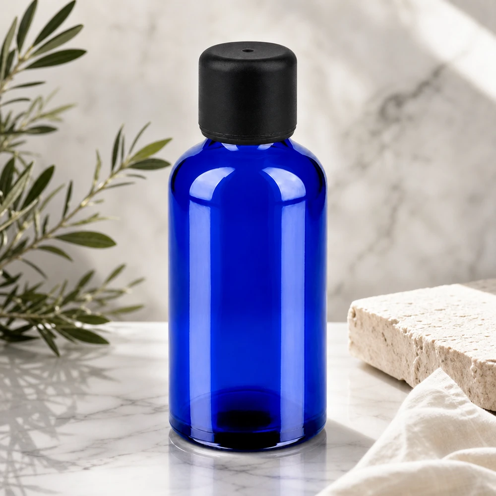 Frasco de vidrio azul de alta calidad de 50 ml con tapón negro mate para productos cosméticos profesionales
