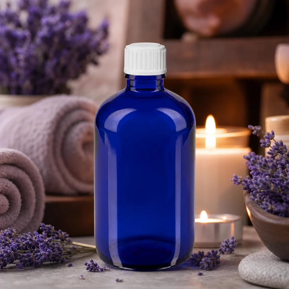 Frasco cuentagotas con protección contra la luz de 100 ml en azul cobalto con tapón dosificador de precisión de 0,9 mm para cosmética natural