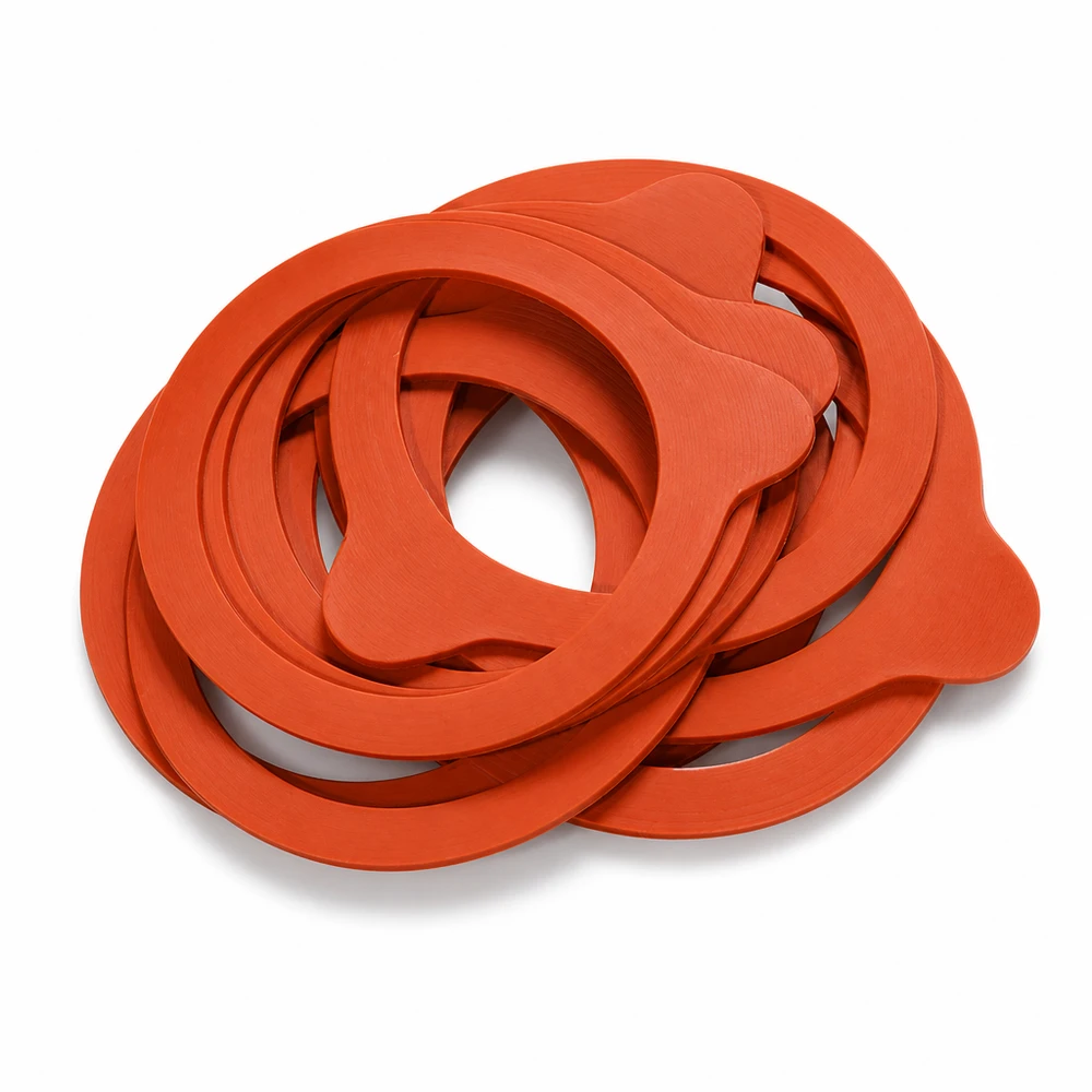 Anillas para conservas RR60 caucho natural naranja apiladas anidadas Primer plano de juntas de goma Tarros para conservas