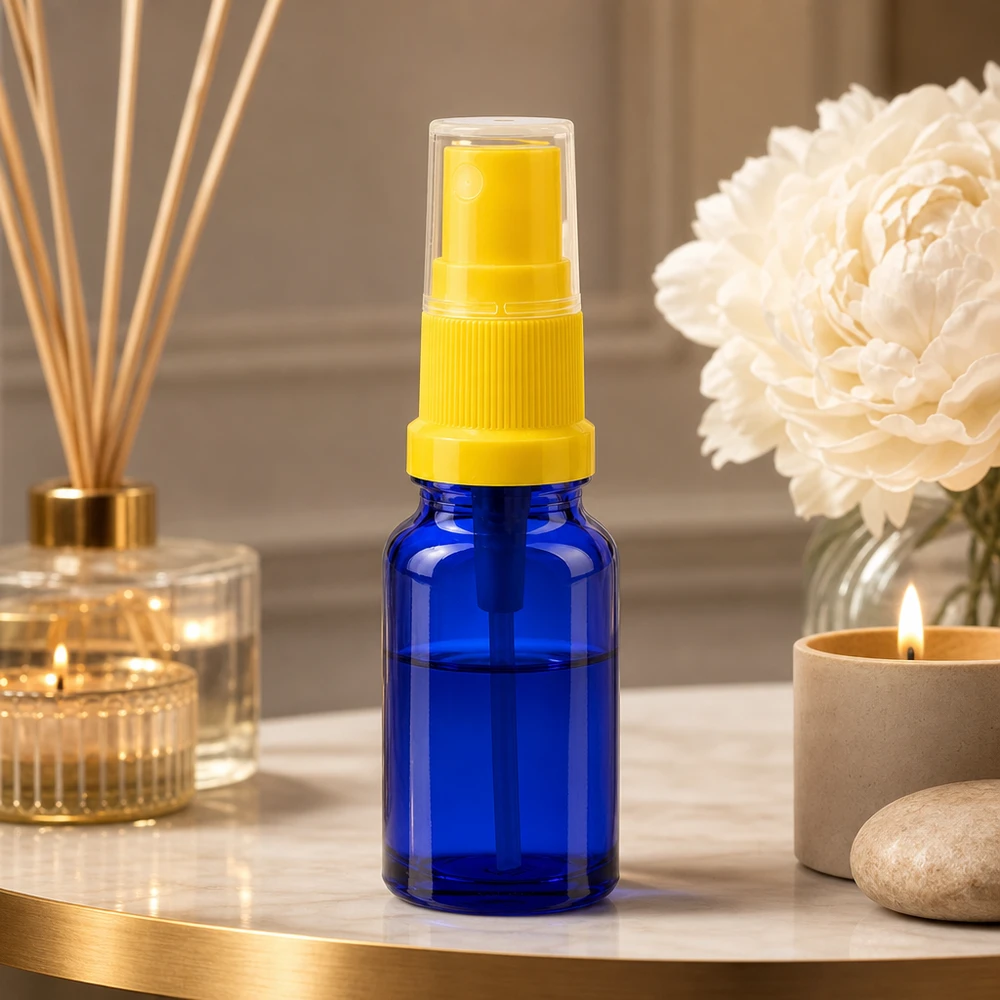 Pulverizador de vidrio azul de 10 ml con cabezal amarillo para cosméticos y perfumes BlueLine UT18 10