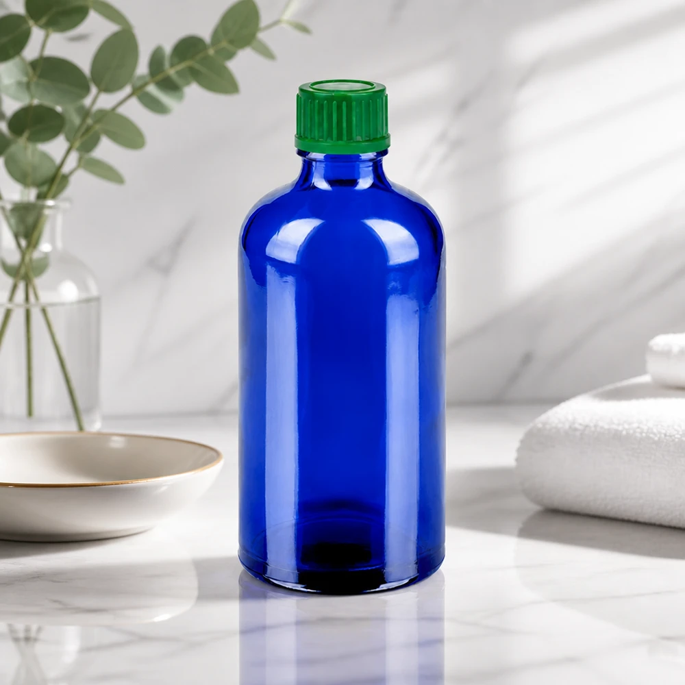 Botella 100ml 11mm tapón rosca verde estándar BlueLine UT18/100 Pequeña botella de vidrio de 100 ml en elegante azul con práctico tapón de rosca para llevar