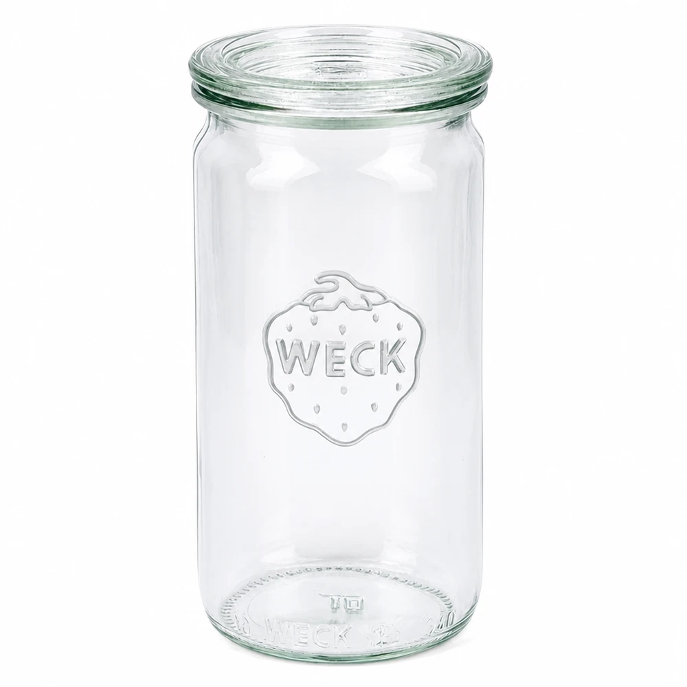 Tarro cilíndrico de 340ml con tapa de cristal WECK RR60 WECK tarro cilíndrico 340ml con tapa de cristal RR60 tarro de conserva transparente vacío sobre fondo blanco