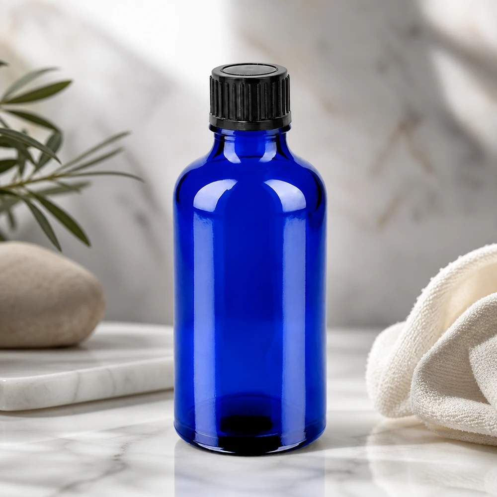 Frasco compacto de cristal de 50 ml en elegante azul cobalto ideal para sueros y esencias