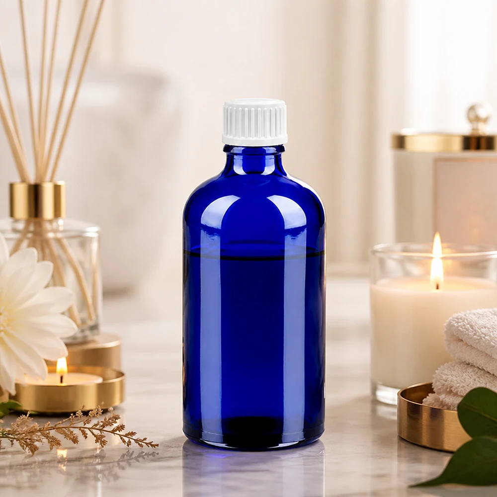 Elegante frasco de cristal azul de 100 ml con tapón cuentagotas blanco para aromaterapia y aceites esenciales