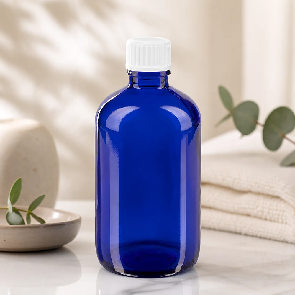 Frasco cuentagotas de 100 ml de color azul cobalto con tapón de rosca de plástico blanco a prueba de niños