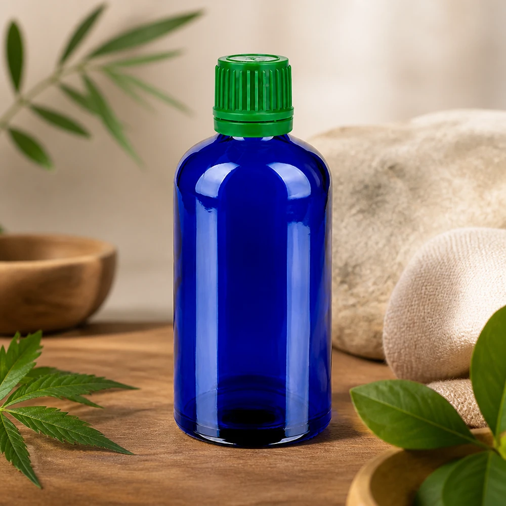 Frasco de 100 ml en azul cobalto brillante con tapón verde de seguridad para cosmética natural y tinturas