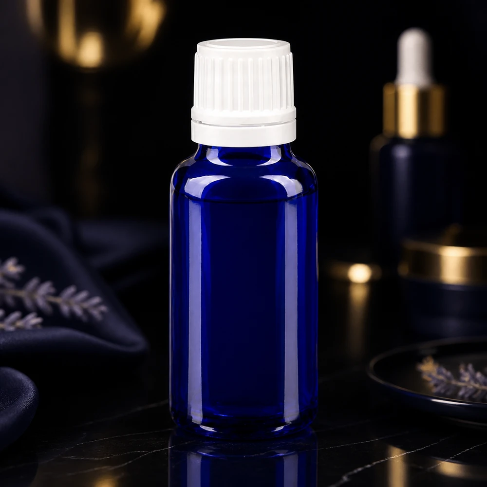 Frasco de cristal azul de 20 ml con tapón de rosca blanco y gotero para aceites esenciales