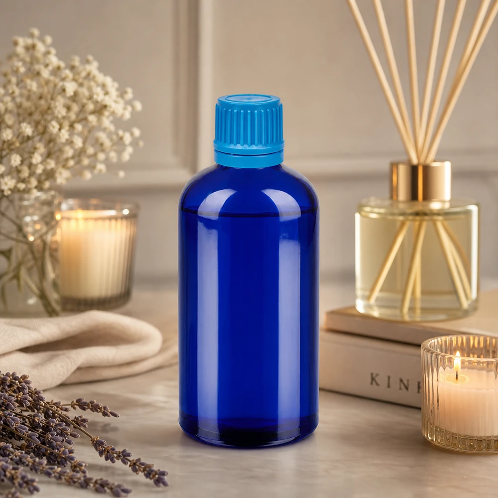 Elegante botella de cristal azul de 100 ml con rosca UT18 ideal para aceites esenciales y productos de bienestar