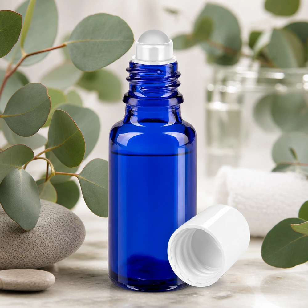 Botella de farmacia azul 20ml tapón roll-on blanco Frasco azul de 20 ml con aplicador de bola, de cristal de farmacia, con ramitas de eucalipto y piedras naturales