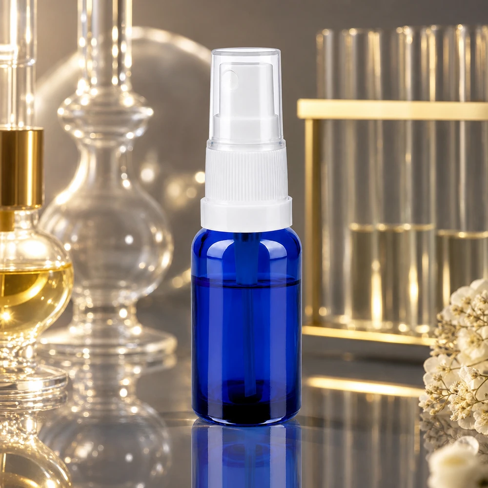 Frasco pulverizador compacto de 20 ml de vidrio azul de alta calidad con accesorio pulverizador blanco ergonómico