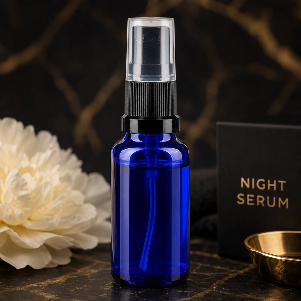 Frasco pulverizador azul de 20 ml de cristal de farmacia con atomizador negro para guardar el sérum de noche