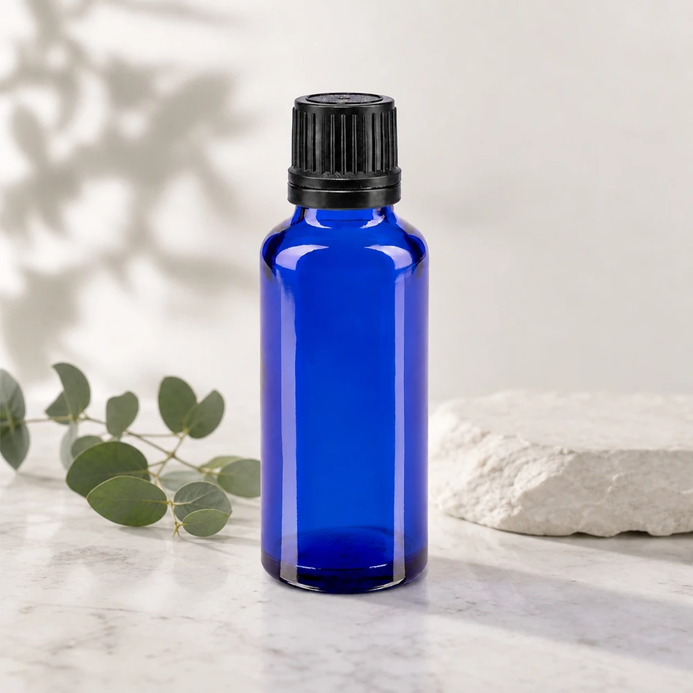 Frasco farmacéutico de cristal azul de 30 ml con tapón de rosca negro y gotero