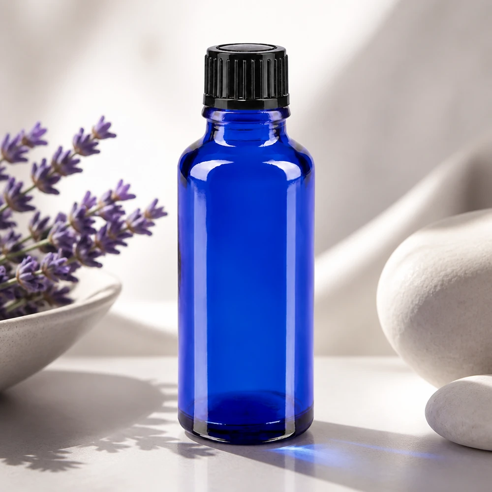 Botella de farmacia azul 30ml tapón cuentagotas 1mm negro estándar Frasco cuentagotas STD de 30 ml, de color azul cobalto y diseño estilizado, con una abertura precisa de 1 mm para aceites esenciales