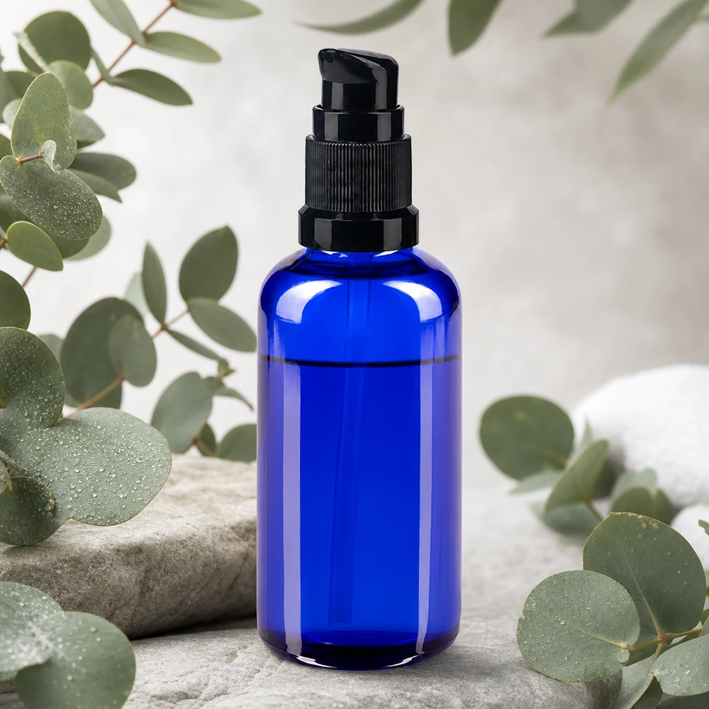 Frasco de cristal de 50 ml de color azul cobalto con dosificador negro, ideal para sérums y aceites