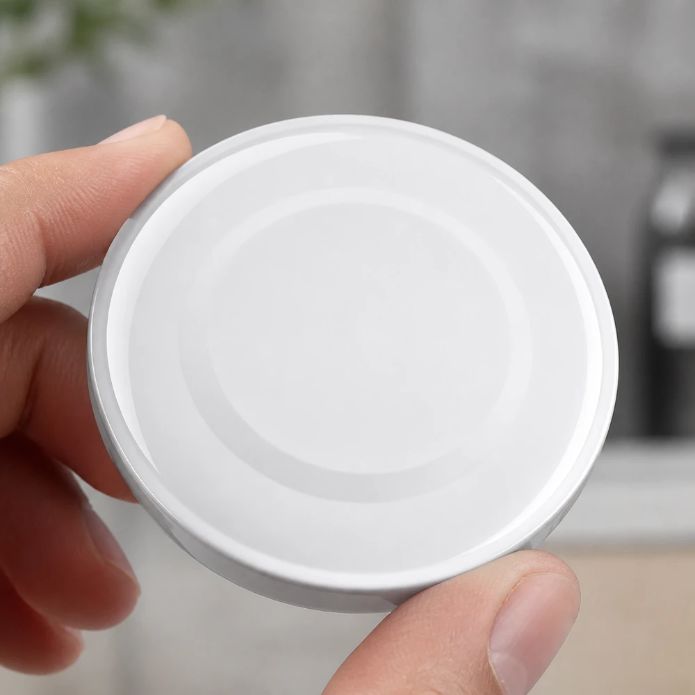 Vista superior de una tapa blanca TO48 Twist-Off de 48 mm «BasicSeal» de UNiTWIST