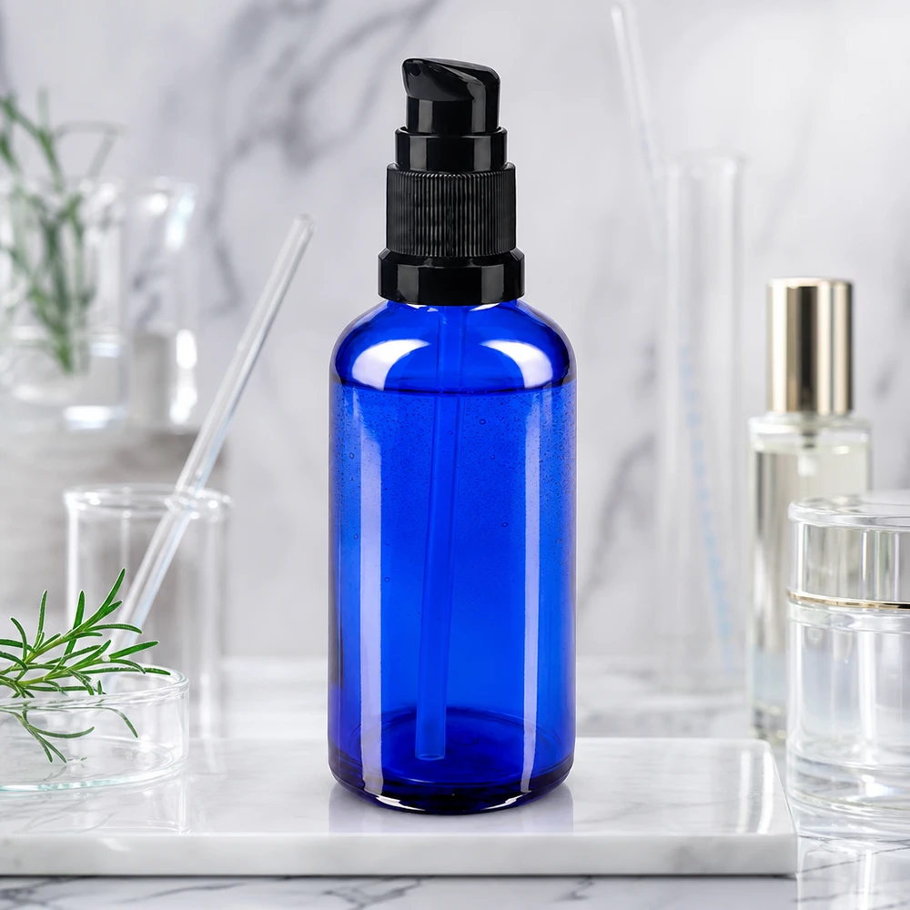 Frasco de farmacia cilíndrico de cristal de 50 ml, de color azul, con dosificador negro