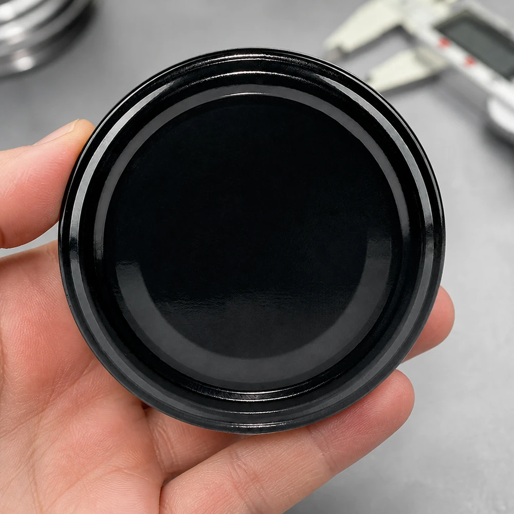 UNiTWIST TO82 negro, BioSeal, sin BPA, UNiTWIST Vista superior del UNiTWIST TO82: tapa metálica negra BioSeal sin BPA, forma redonda y superficie brillante