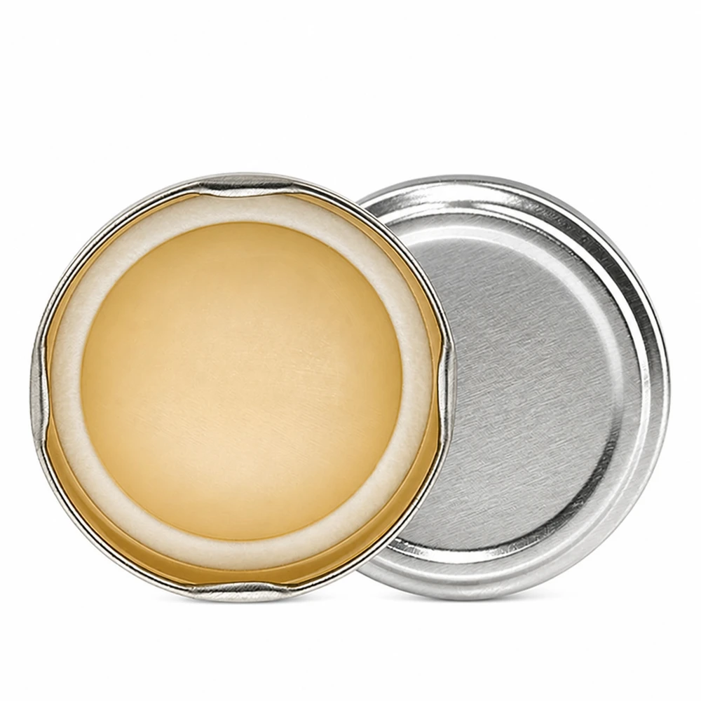 Tapa BasicSeal de 66 mm, color plateado (TO66) UNiTWIST Tapa BasicSeal de 66 mm, color plata, modelo TO66 UNiTWIST, abierta, con masilla de sellado amarillenta vista desde arriba
