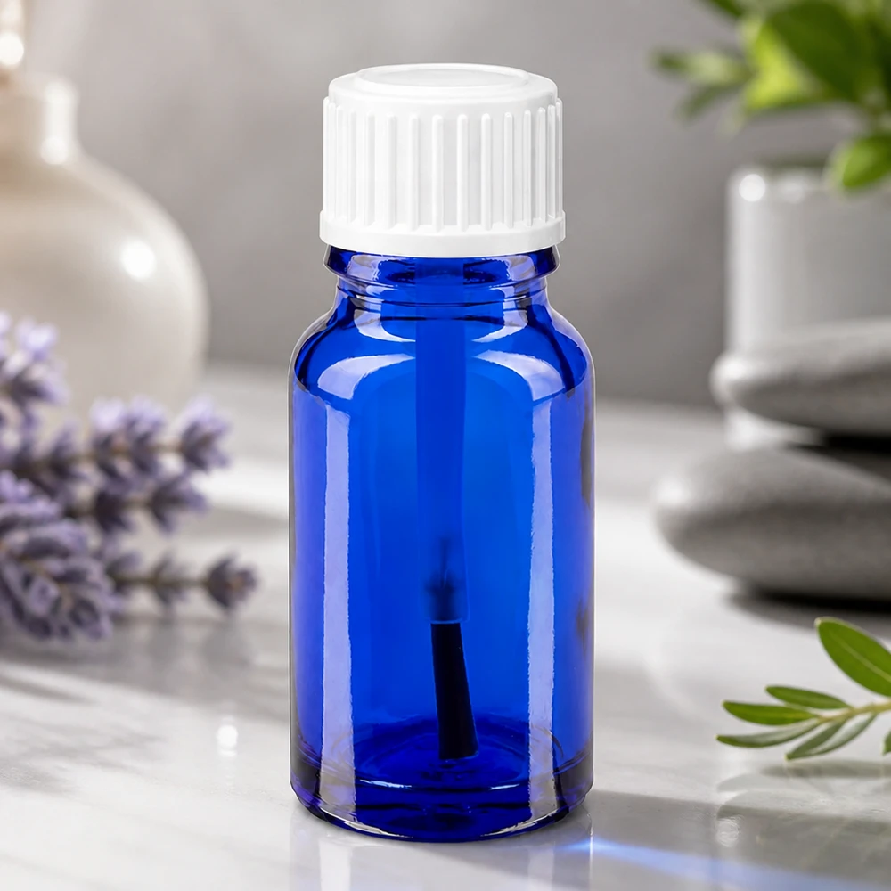 Frasco con pincel de 10 ml de color azul cobalto, fabricado en vidrio de calidad farmacéutica, con tapón blanco a prueba de niños