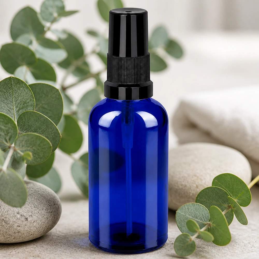 Frasco pulverizador de 50 ml de vidrio azul de alta calidad con robusto cabezal pulverizador negro para aromaterapia