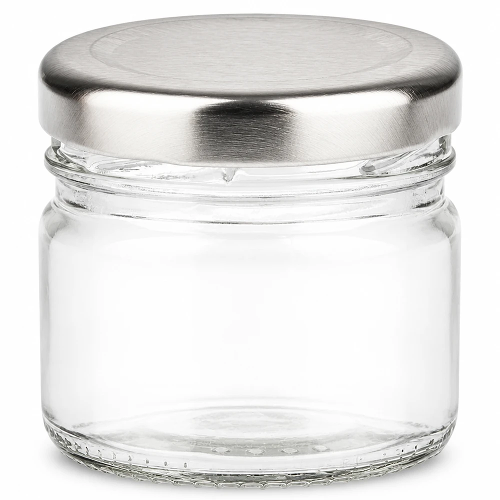 Vaso redondo pequeño de 33 ml con tapa BasicSeal plateada, vacío y transparente visto desde delante