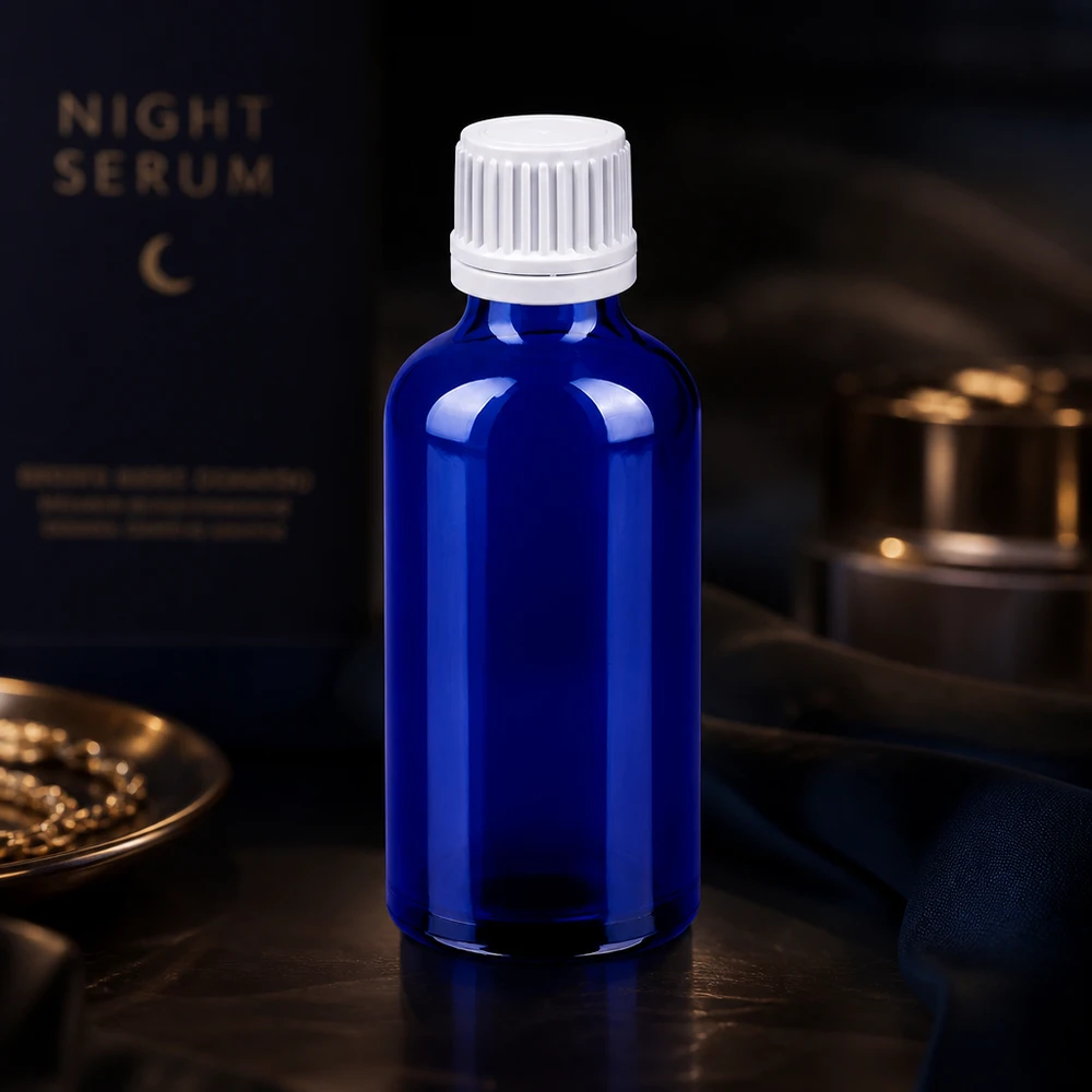 Botella 50ml tapón rosca 11mm blanco cierre inviolable BlueLine UT18/50 Elegante botella de cristal azul de 50 ml con tapón cuentagotas blanco para dosificar líquidos con precisión