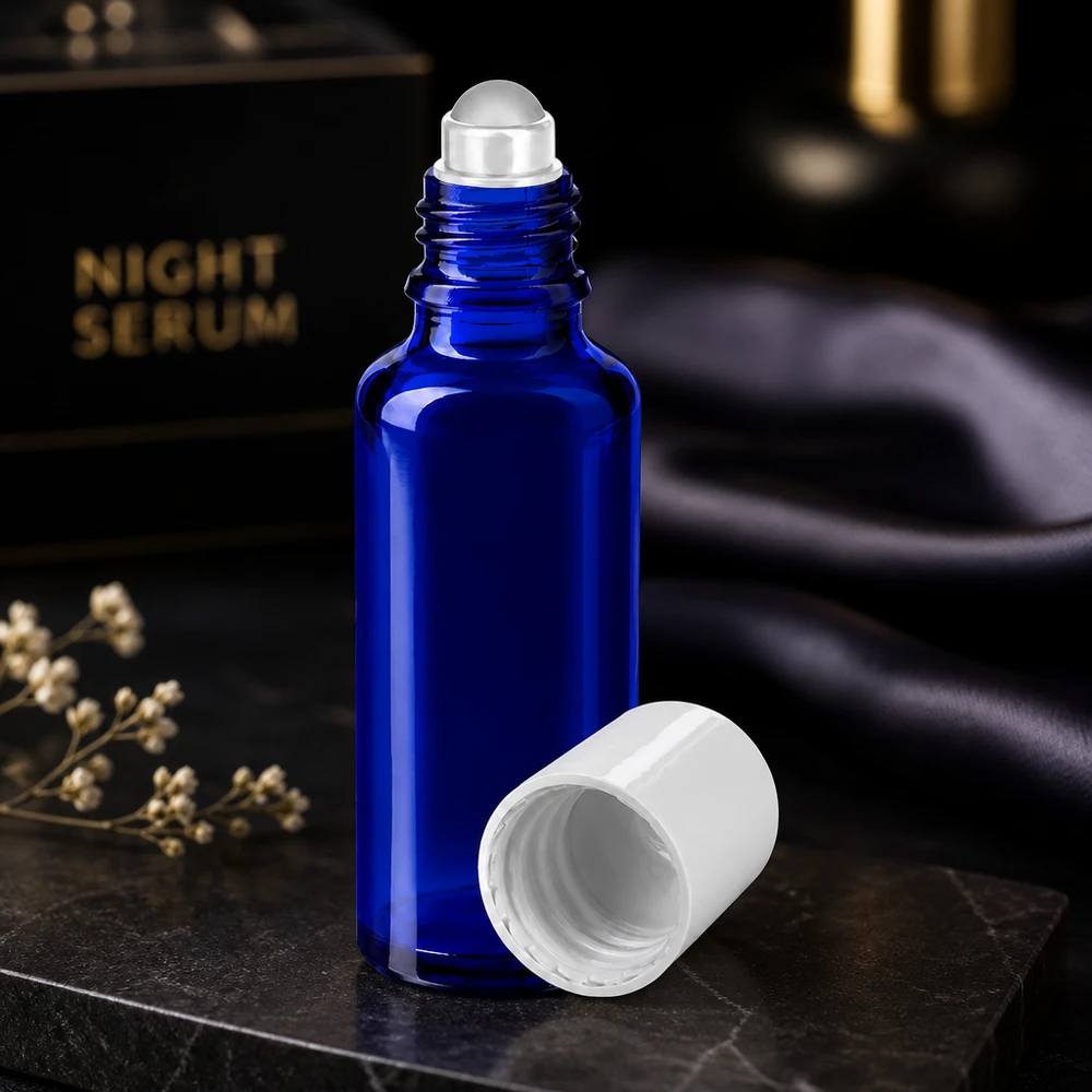 Frasco de cristal azul cobalto de 30 ml con aplicador de bola y tapón blanco para sérum nocturno