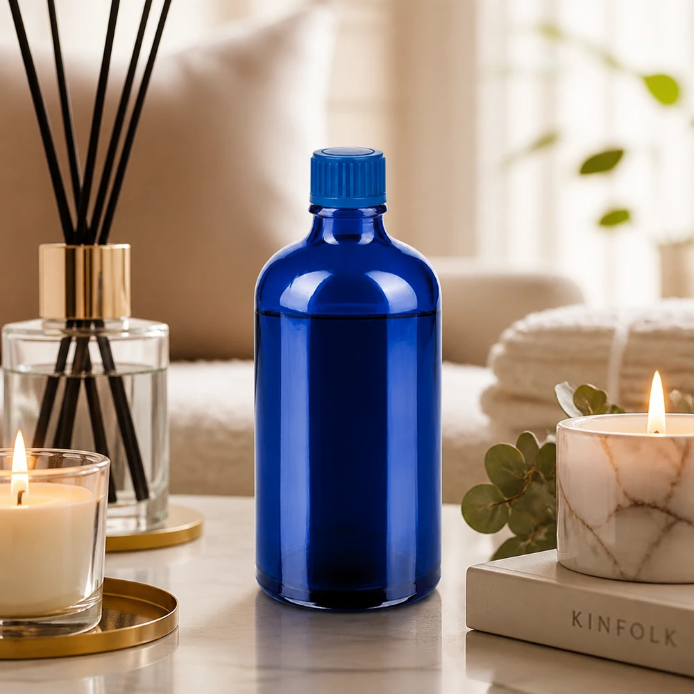Elegante frasco de vidrio azul de 100 ml con tapón de 11 mm para productos cosméticos profesionales
