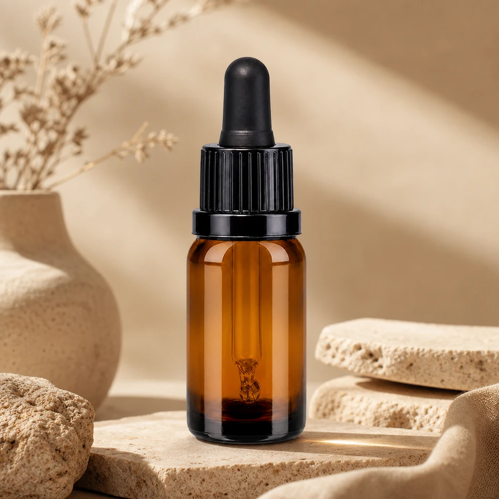 Pipeta compacta de 10 ml en elegante vidrio ámbar con tapón negro para uso profesional