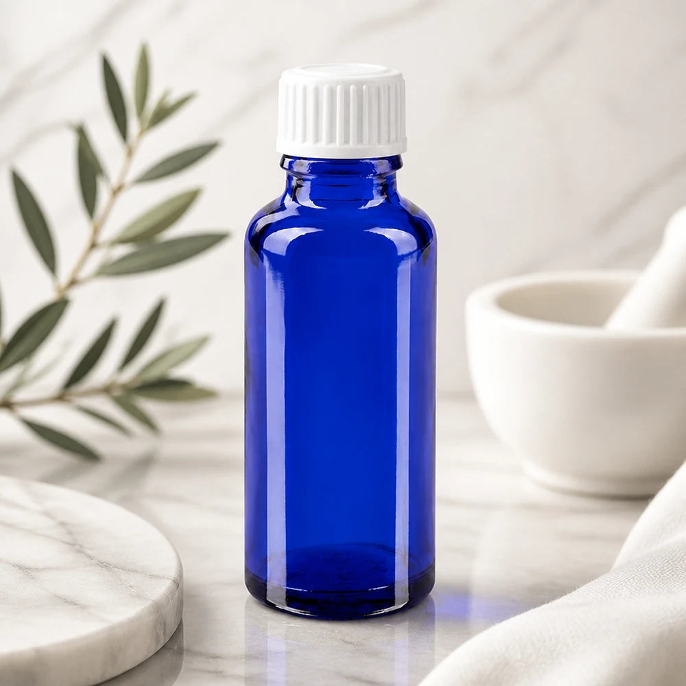 Frasco de farmacia azul cobalto de 30 ml, fabricado en vidrio de alta calidad, con tapón de seguridad blanco