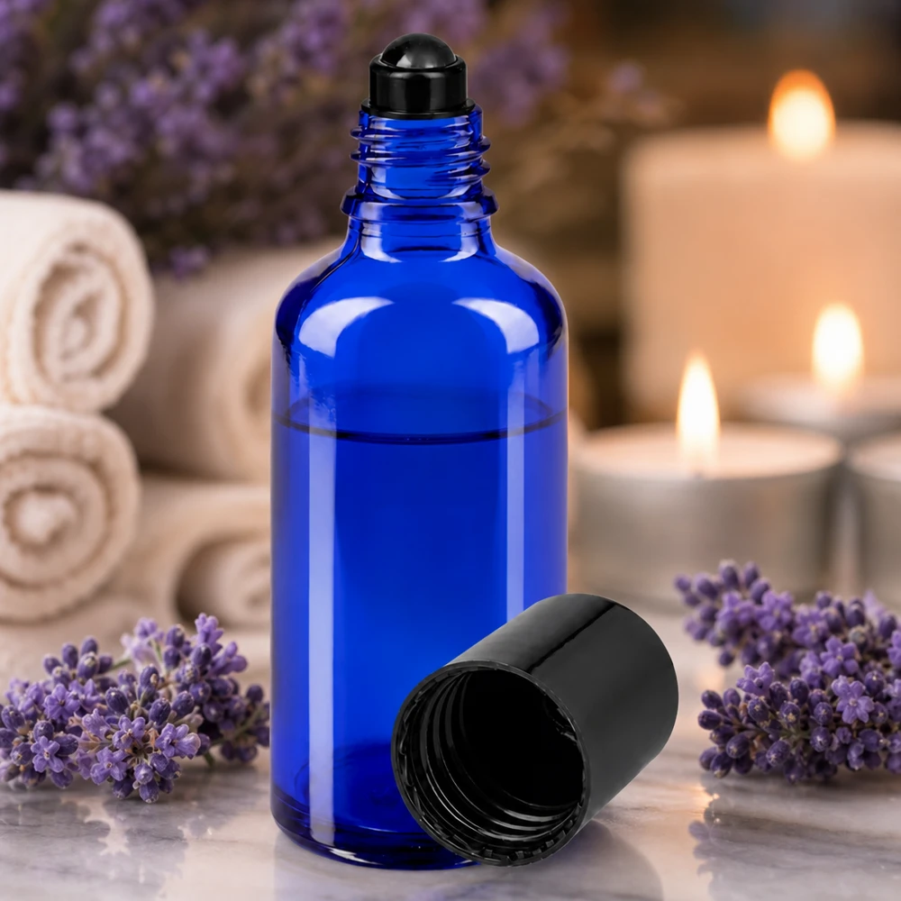 Frasco roll-on de 50 ml de vidrio protector azul cobalto con aplicador de bola negro para aromaterapia