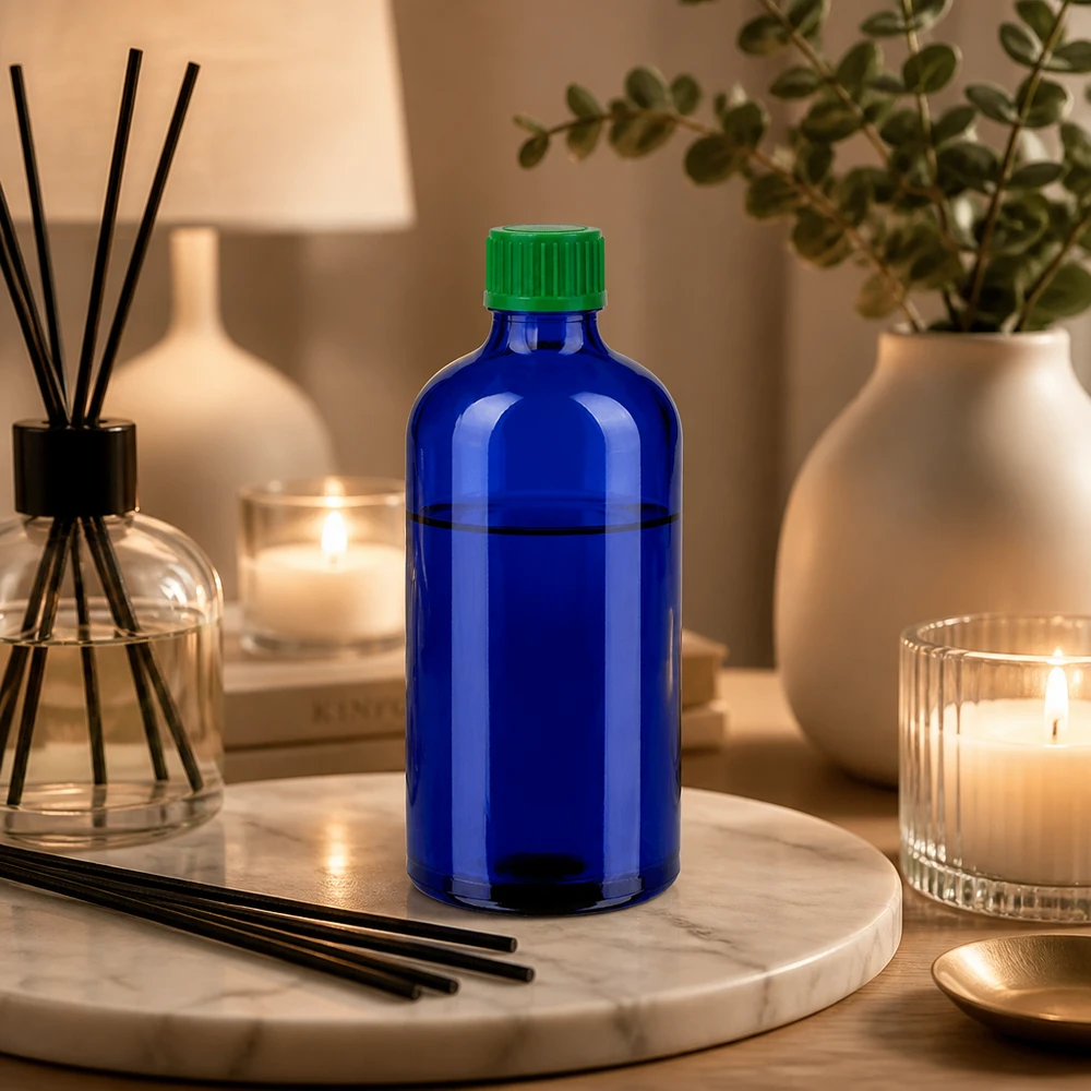 Frasco cuentagotas azul de 100 ml de vidrio de alta calidad con tapón de plástico verde para un almacenamiento seguro