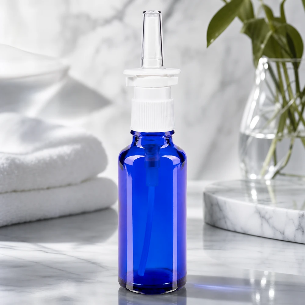Frasco de spray nasal de 30 ml de cristal azul cobalto con dosificador blanco para aplicaciones farmacéuticas